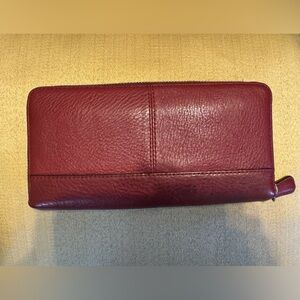 Magenta Coach leather zip around wallet.